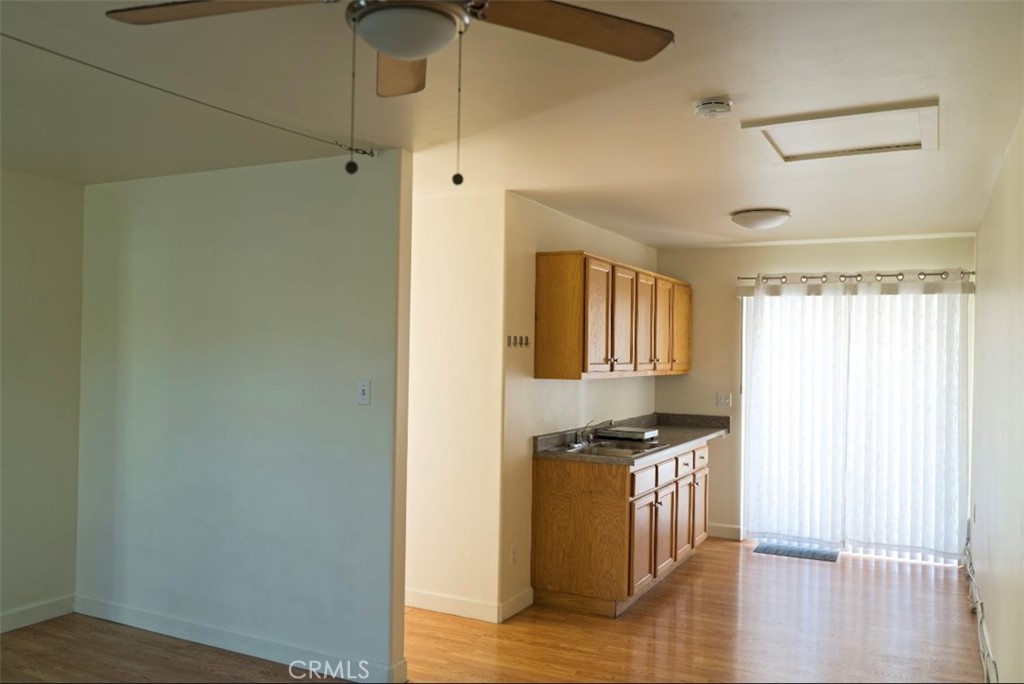 a kitchen with granite countertop a stove and a refrigerator