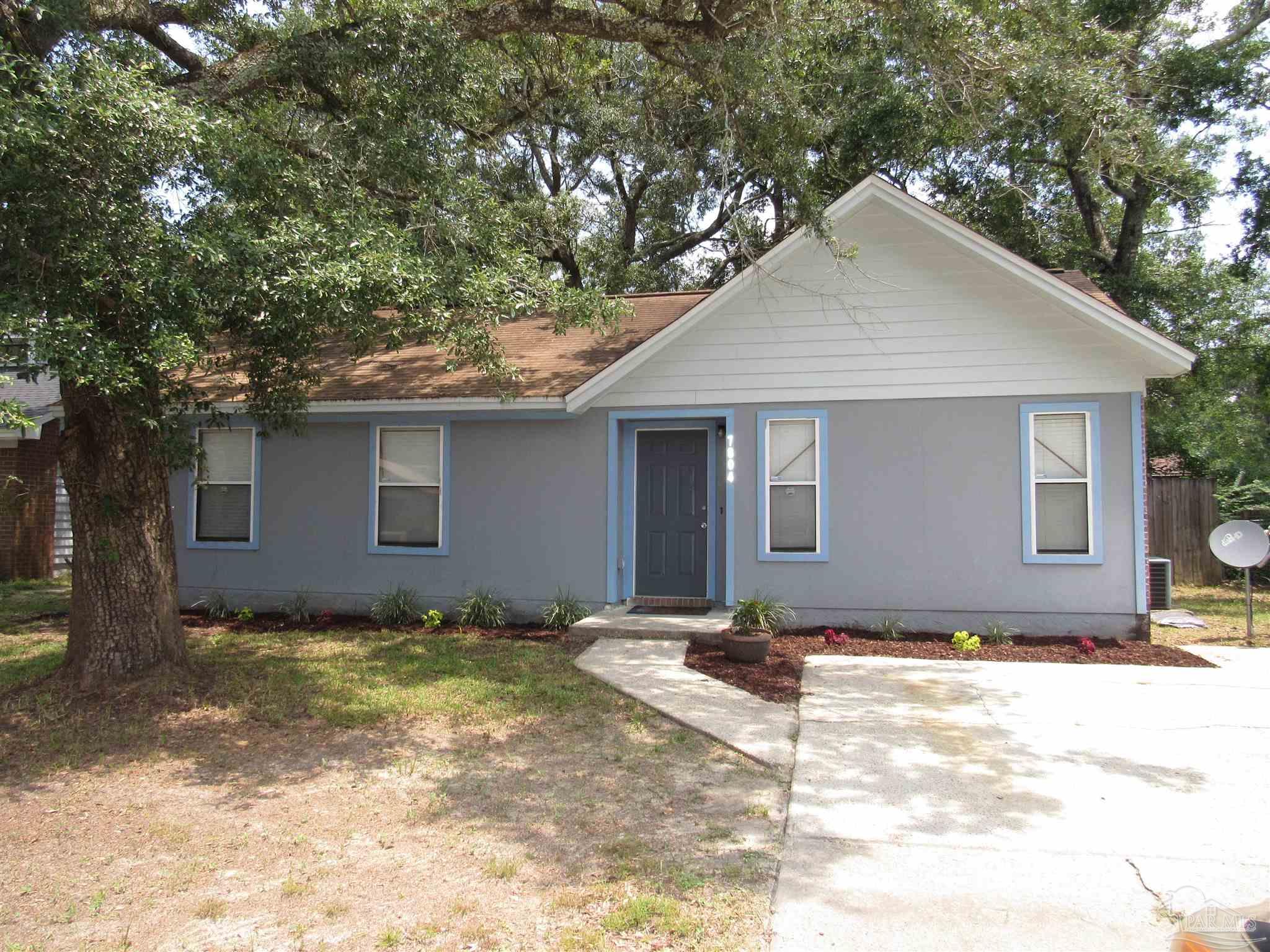 a house with trees in the background