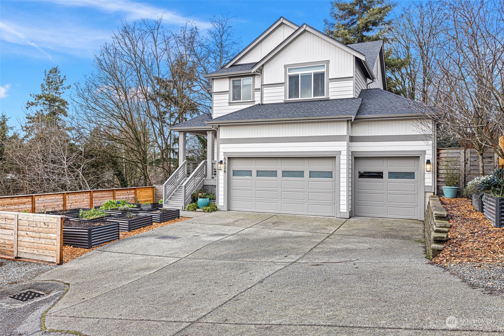 a front view of a house with garage