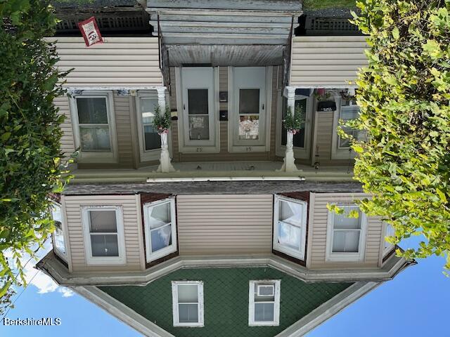 a view of a house with a small garden