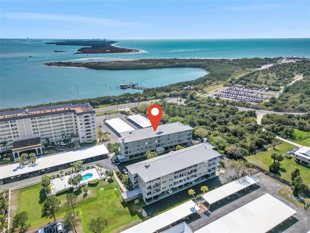 an aerial view of a house with a ocean view