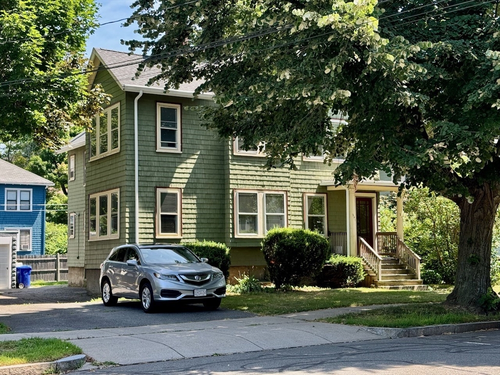 a car parked in front of a house