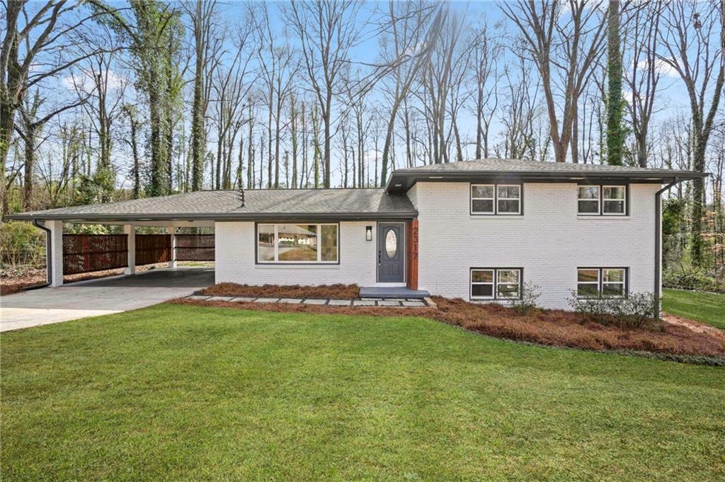 front view of a house with a big yard