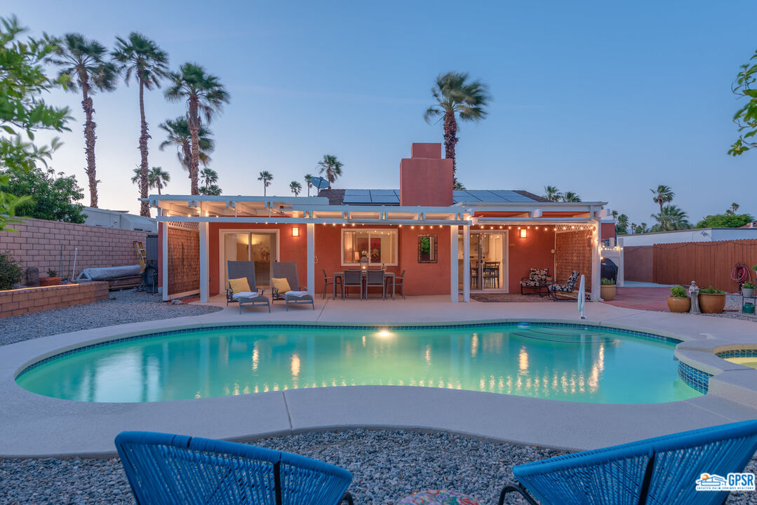 a view of a swimming pool with a patio