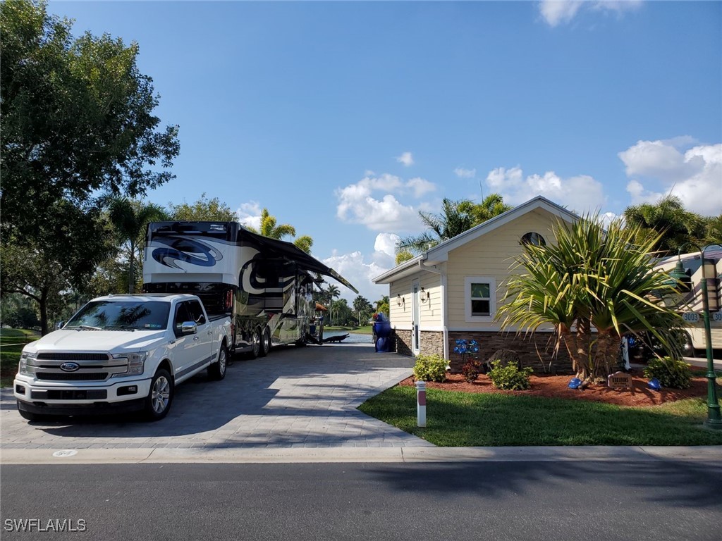 a view of a car park in front of house