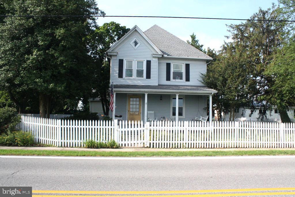 a view of a house and a fence