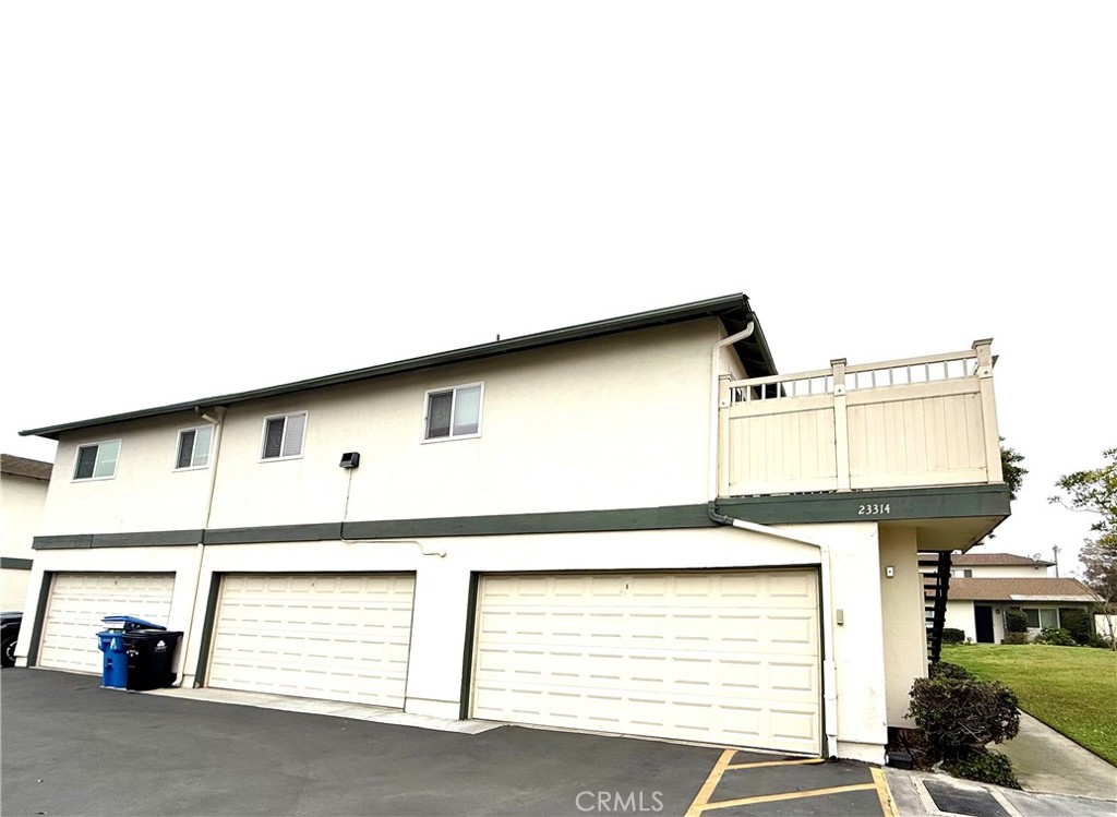 a front view of a house with a garage