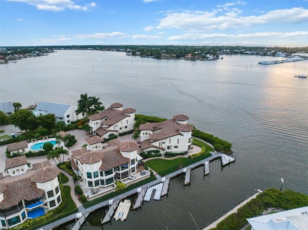 a view of lake from balcony with outdoor seating