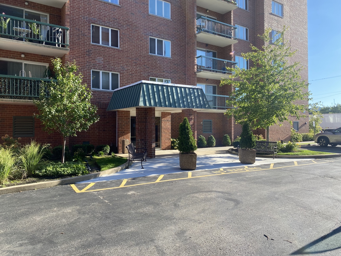 a view of a brick building next to a yard