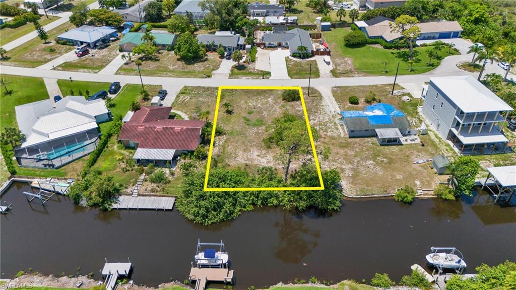 an aerial view of a house with a lake view