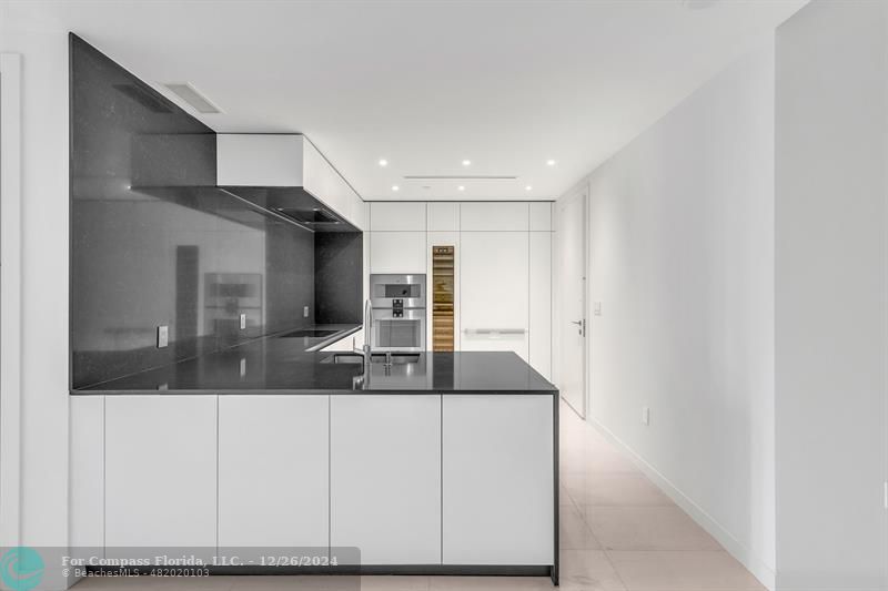 a view of living room with granite countertop furniture and fireplace