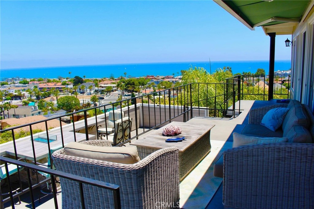 a view of a balcony with lake view and a ocean view