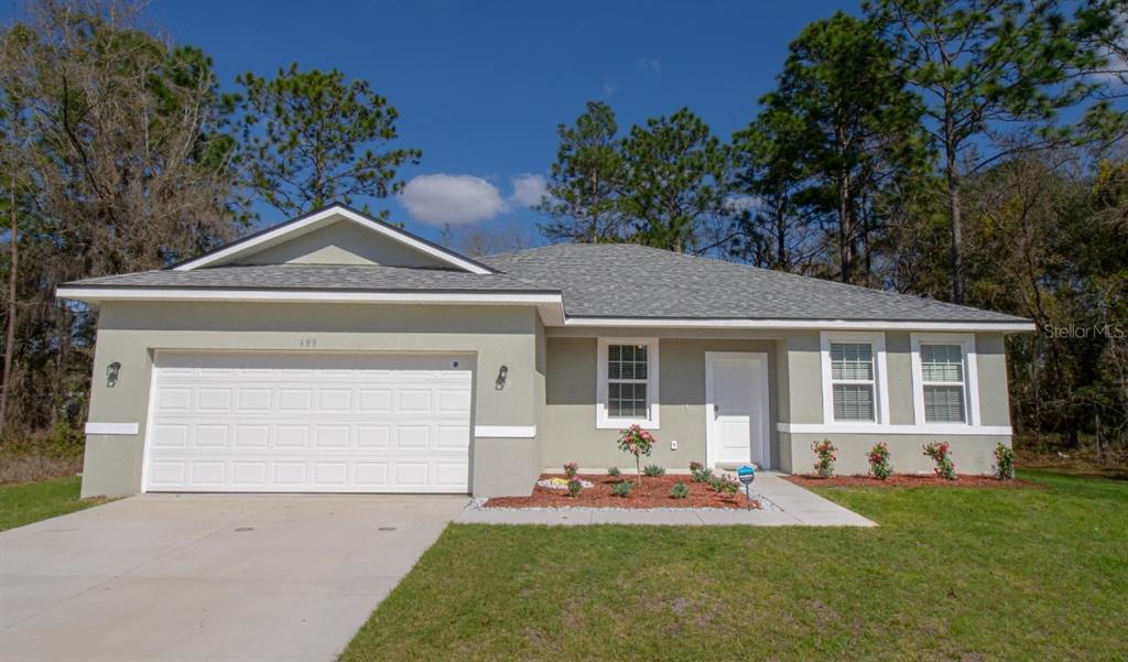 front view of house with a yard