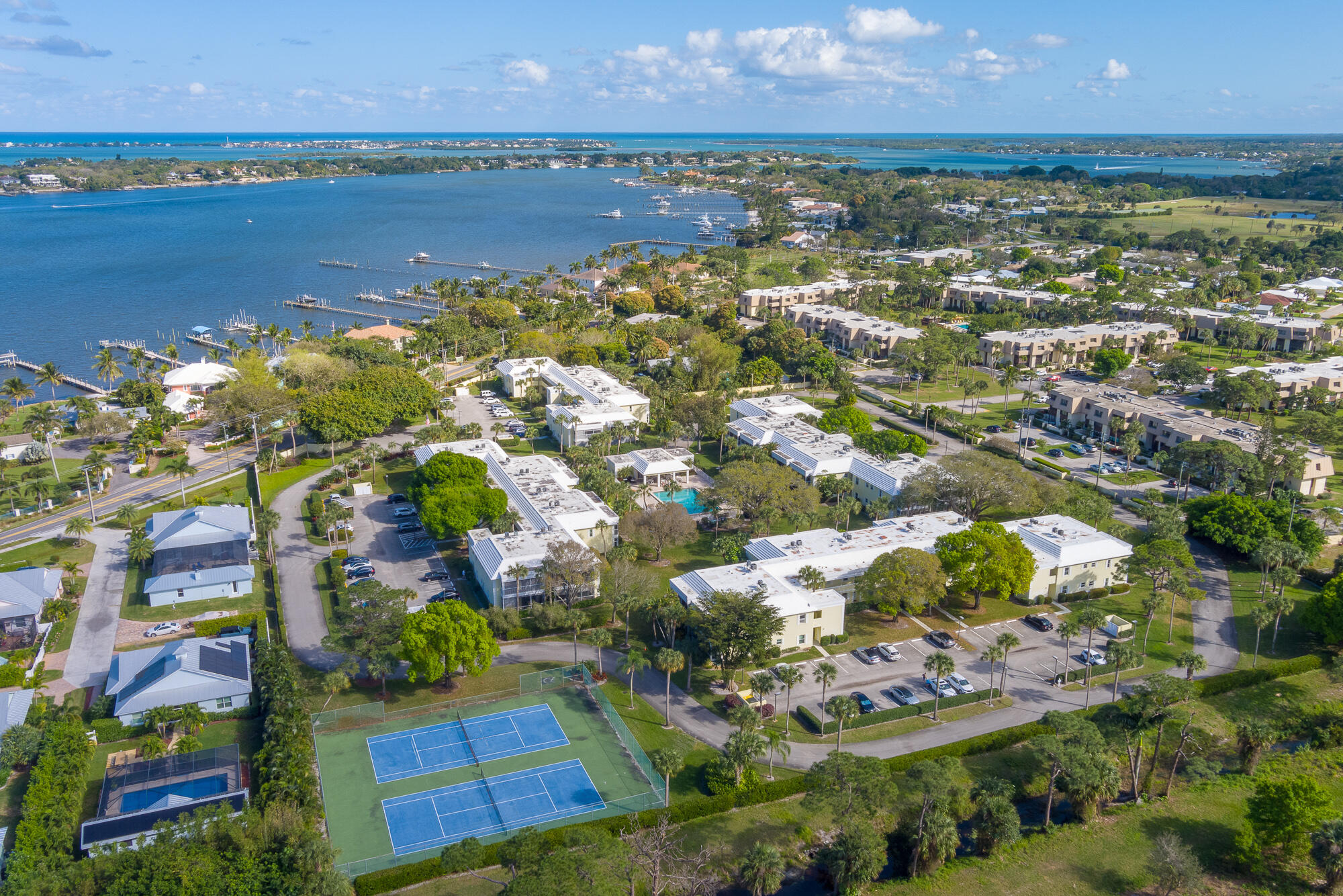 an aerial view of residential building with outdoor space and lake view