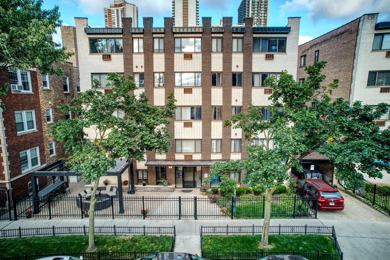 a view of a building with a garden and plants