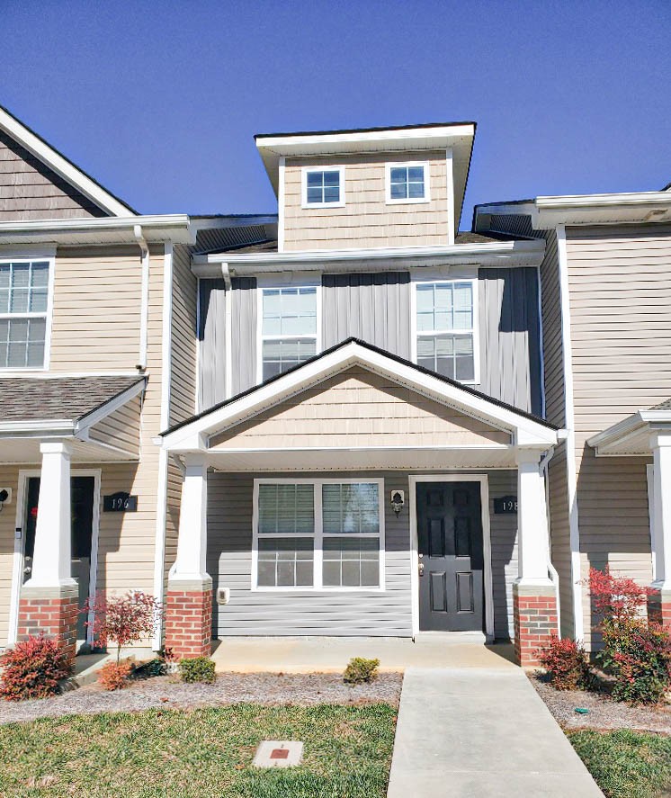 front view of a house with a yard