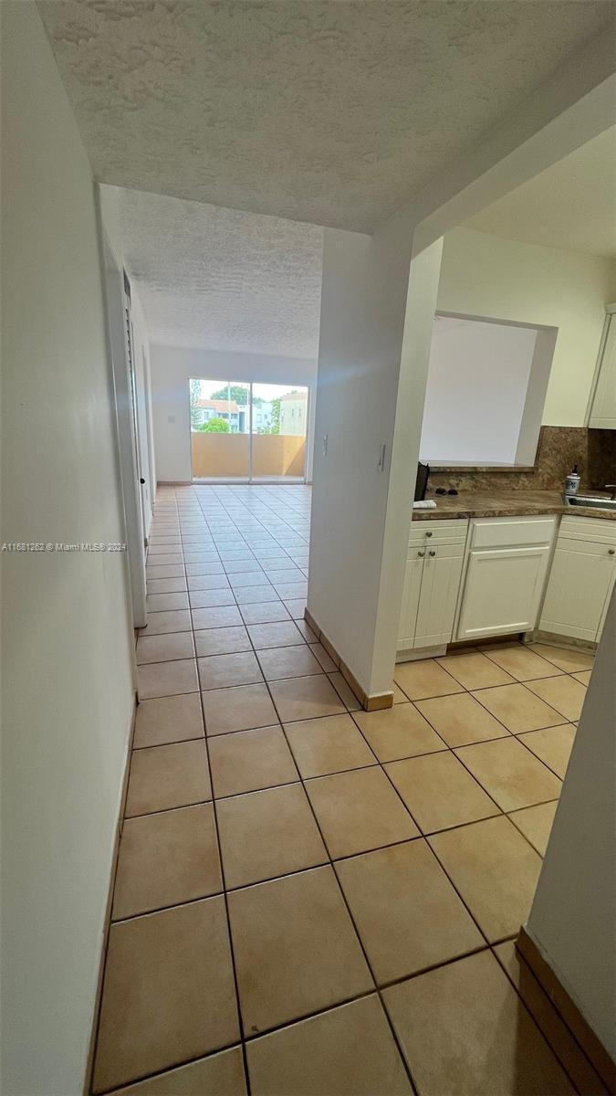 a view of a kitchen with a sink