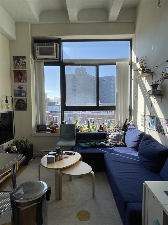 a living room with furniture and a table