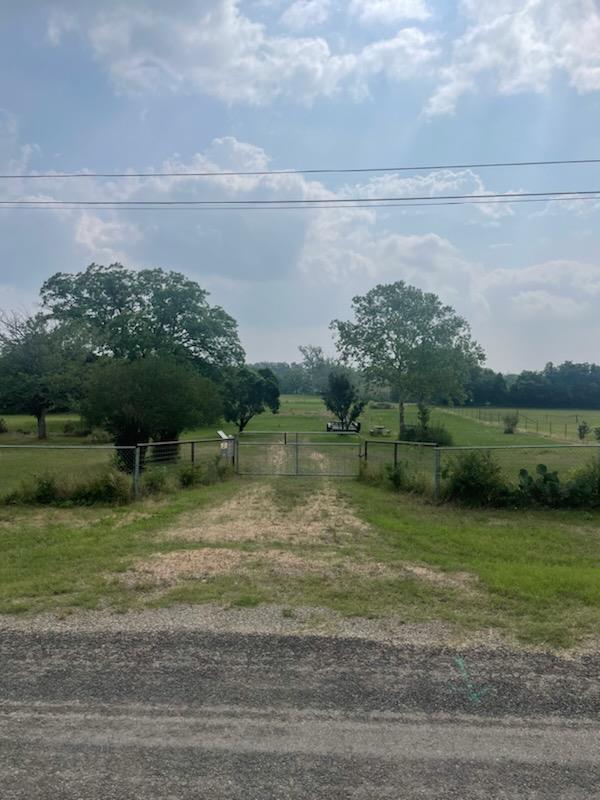 a view of a lake with a big yard