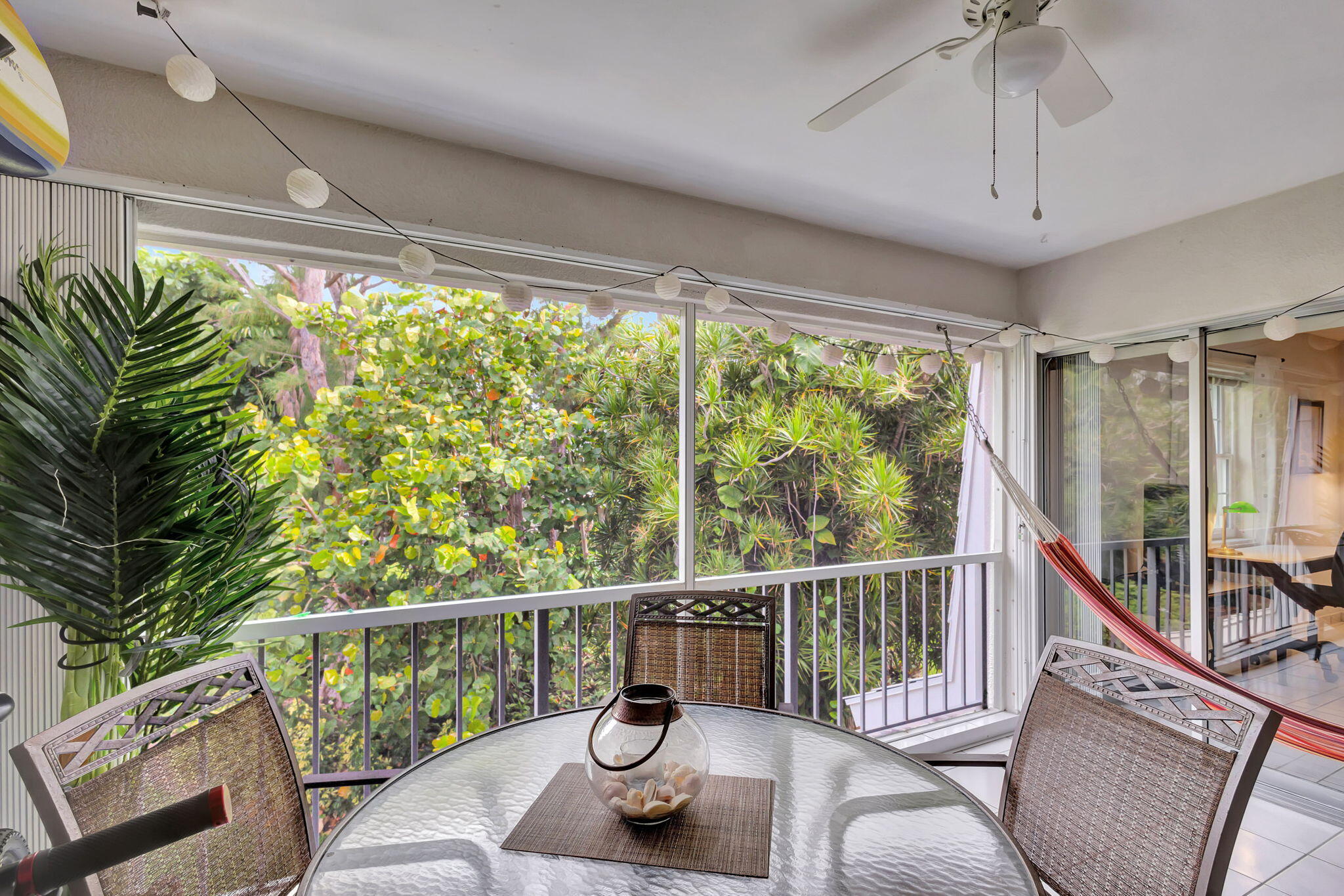 a view of a chair and table in the balcony