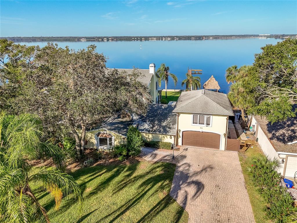 a front view of a house with a lake view