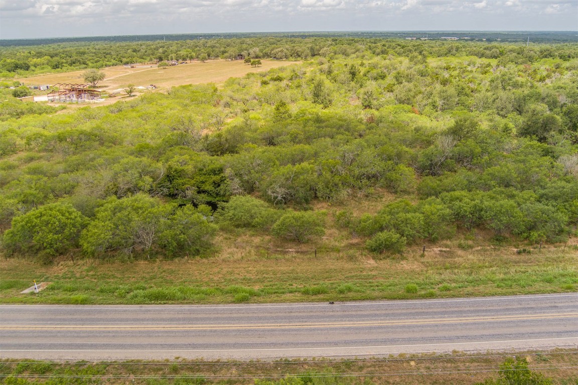 410'+/of road frontage. The Unfinished barn in the background is on the neighboring property and will be completed soon.