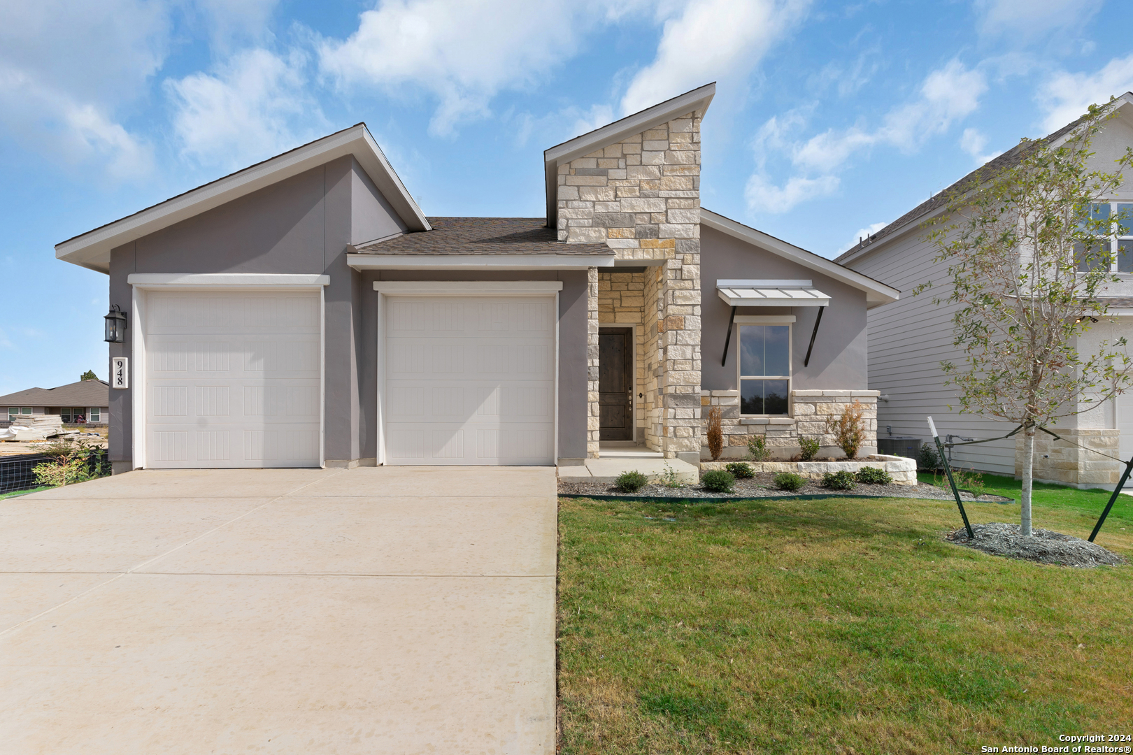 a front view of a house with a yard