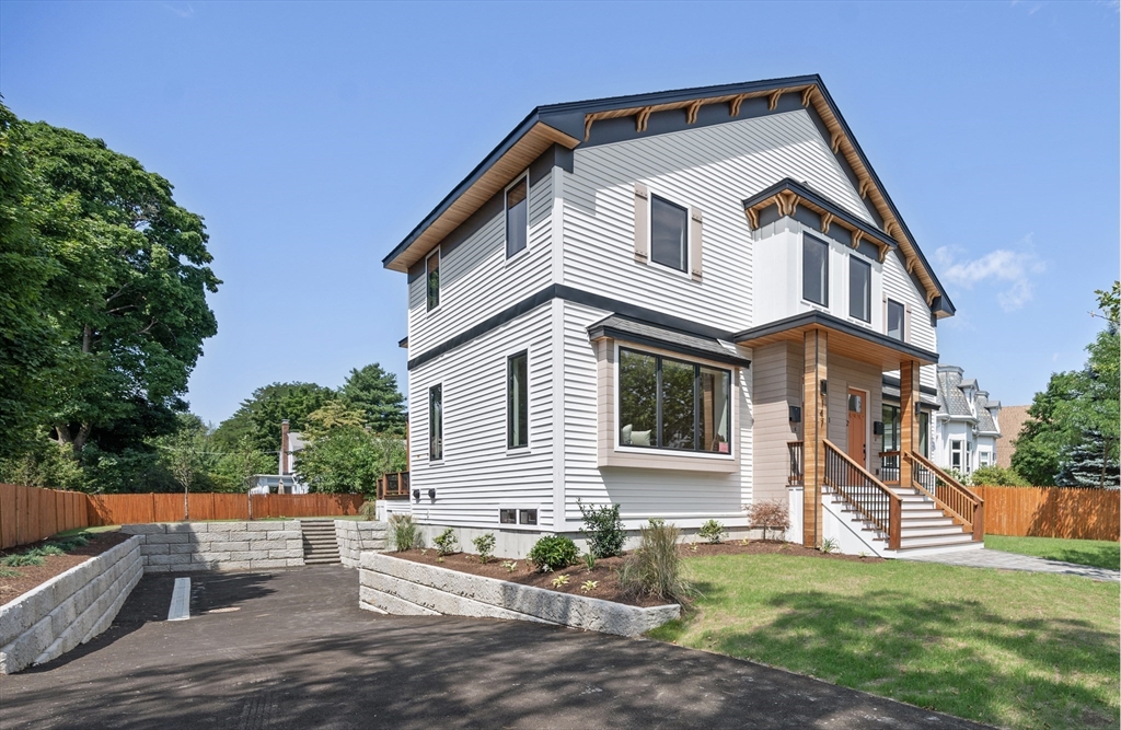 a view of a house with a yard