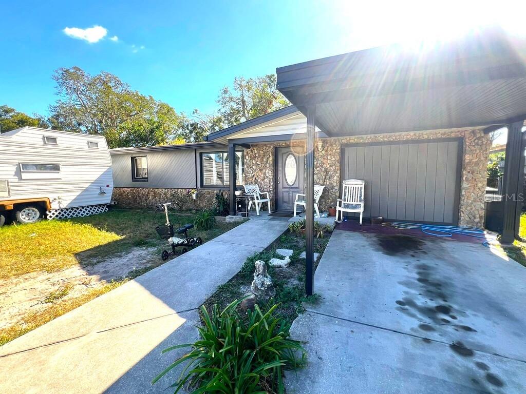 a view of a backyard with sitting area