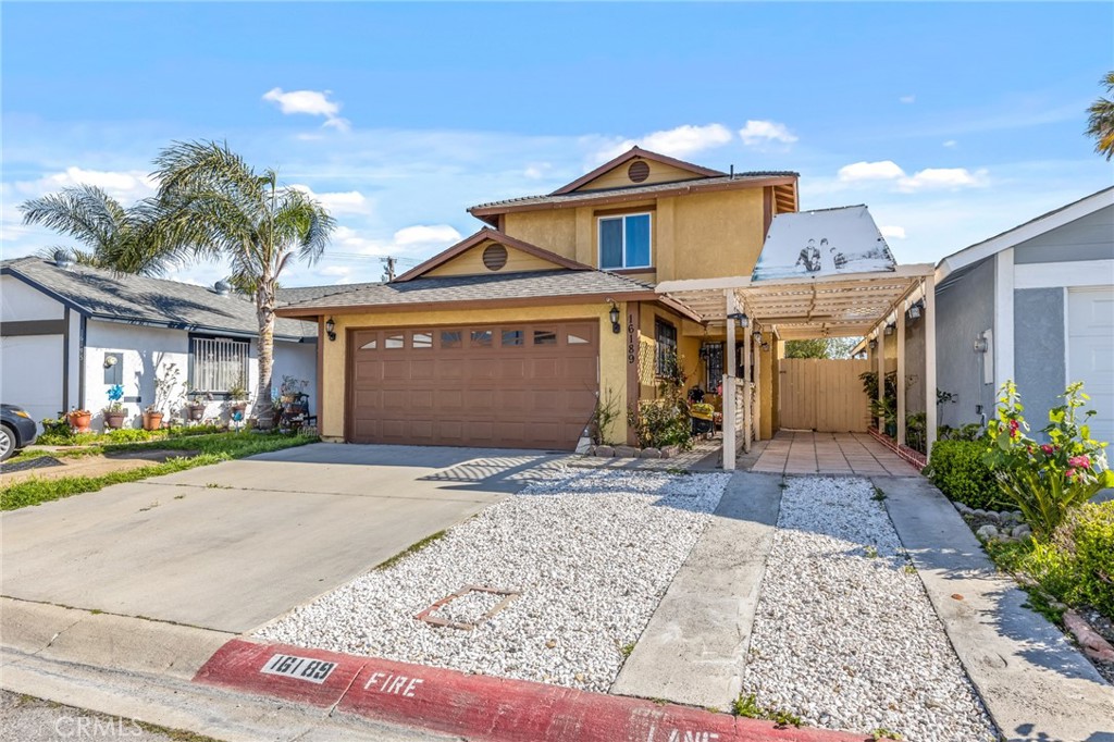 a front view of a house with a yard and a garage