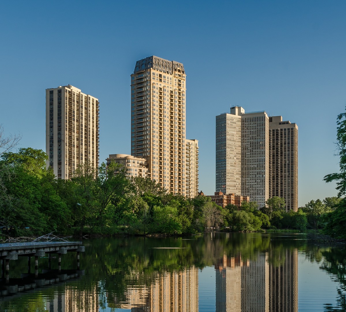 a front view of a building with a lake view