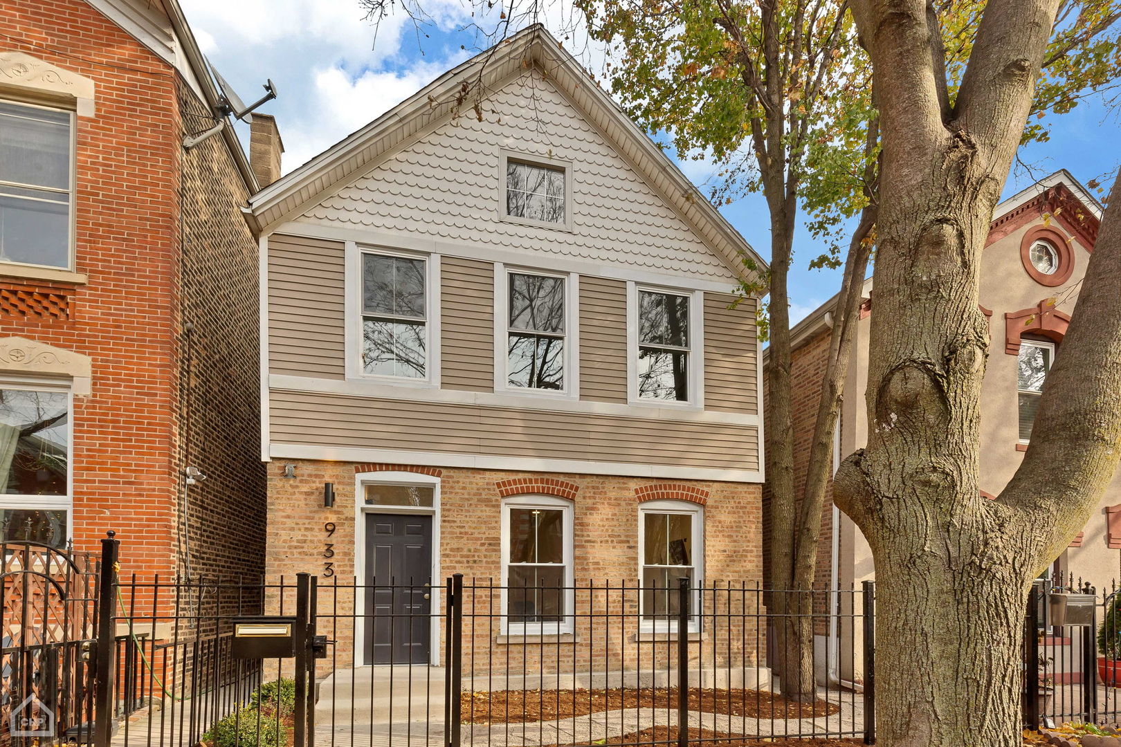 a view of a house with a tree