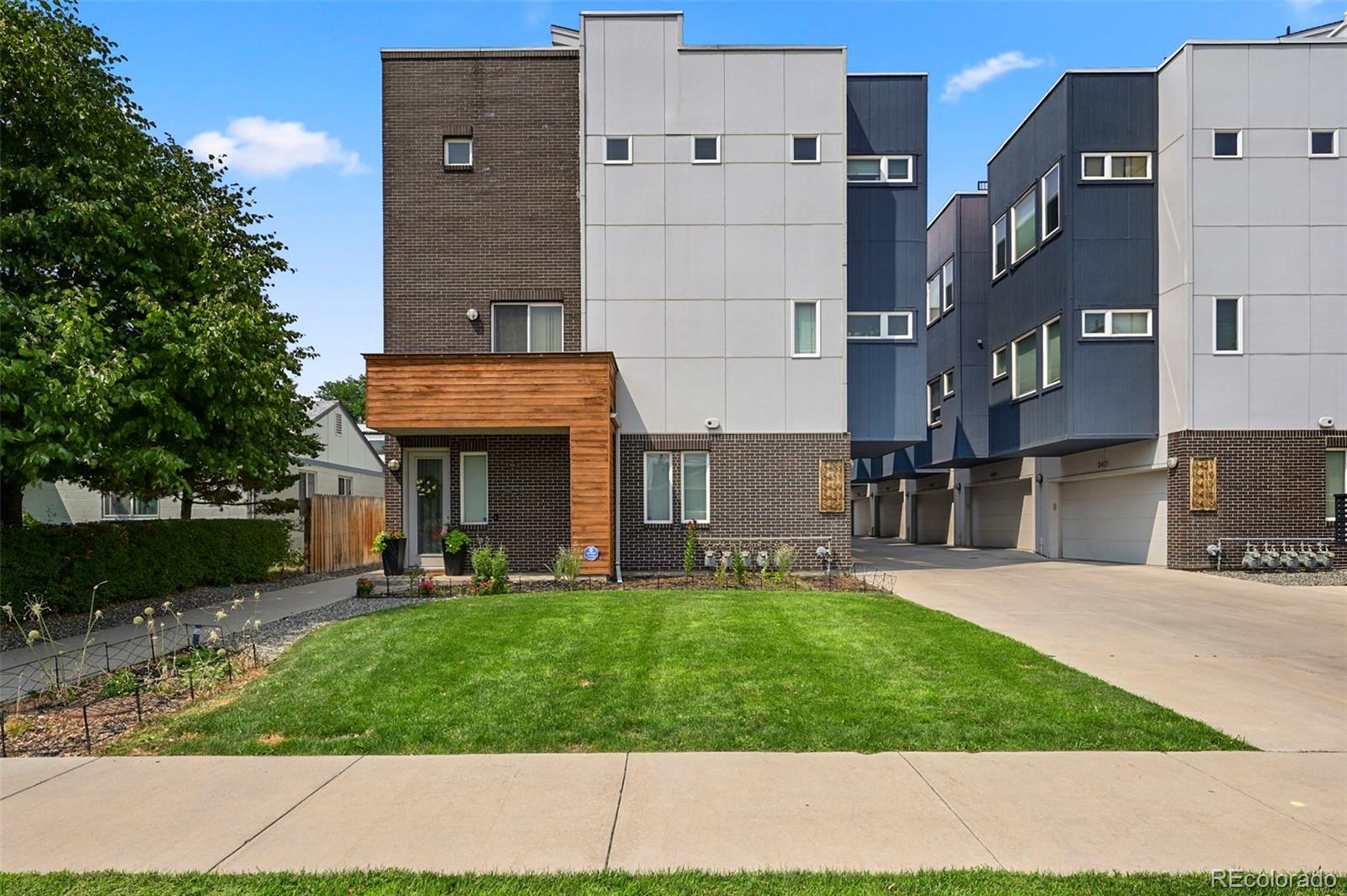 a view of a house with a yard and sitting area