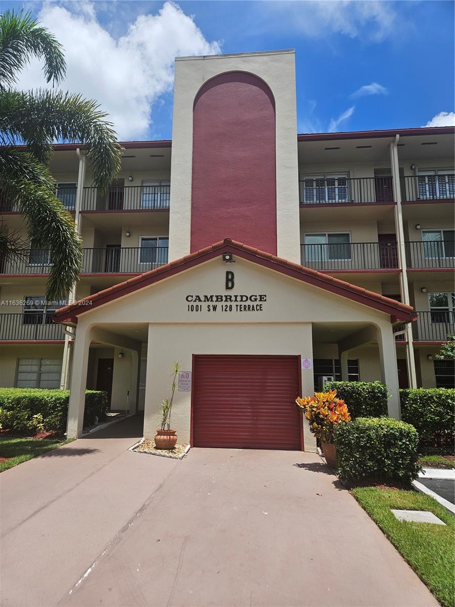 a view of a building with a garden