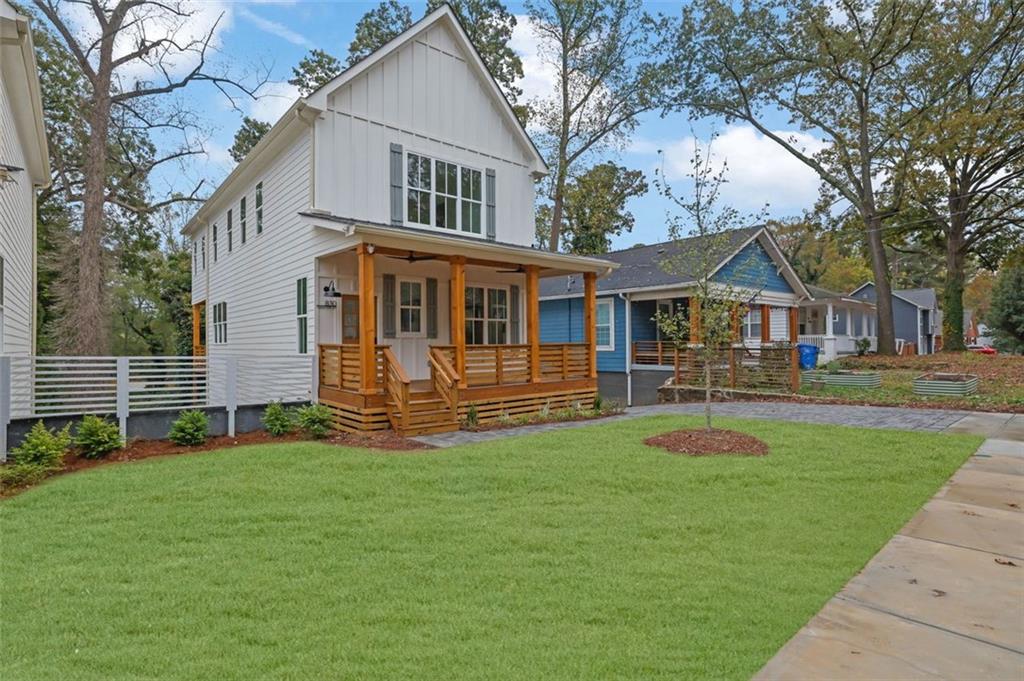 a view of a house with a yard porch and sitting area