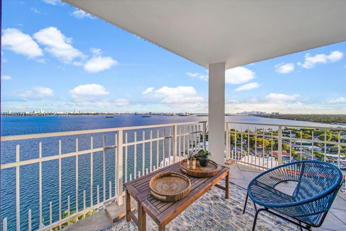 a view of balcony with furniture