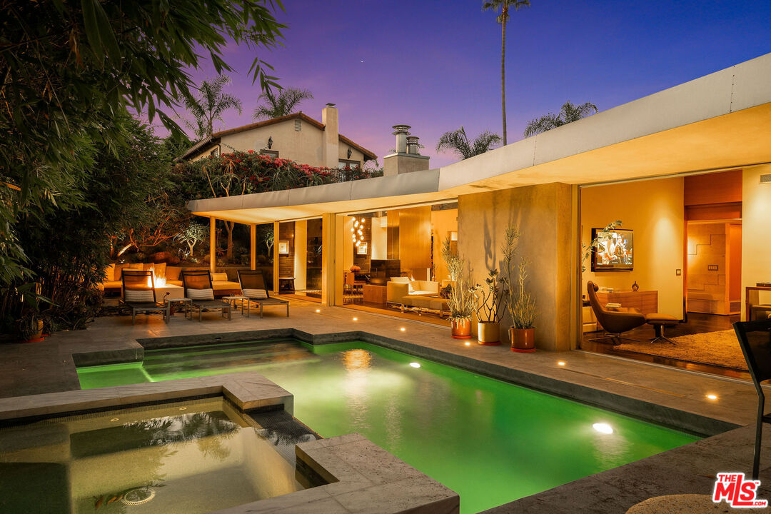 a view of a swimming pool with a patio