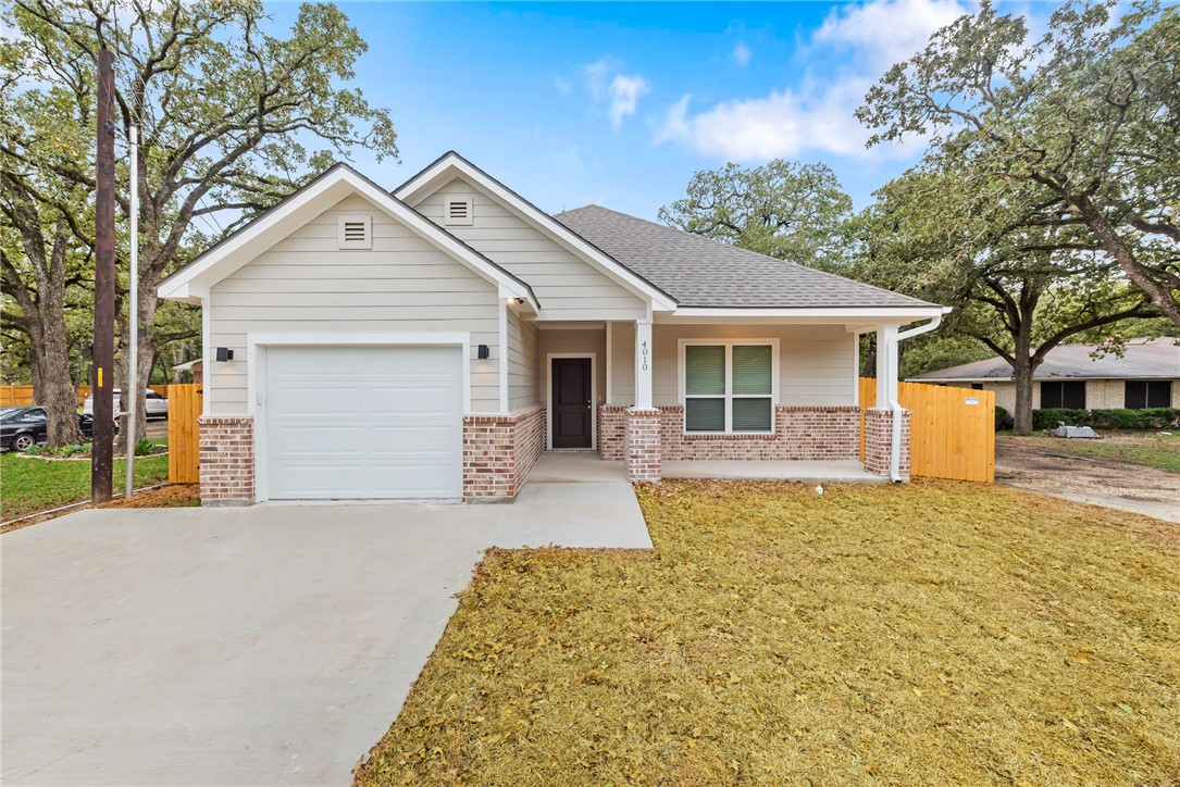 Craftsman-style home featuring a garage and a fron