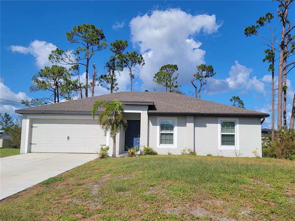 a front view of a house with a yard