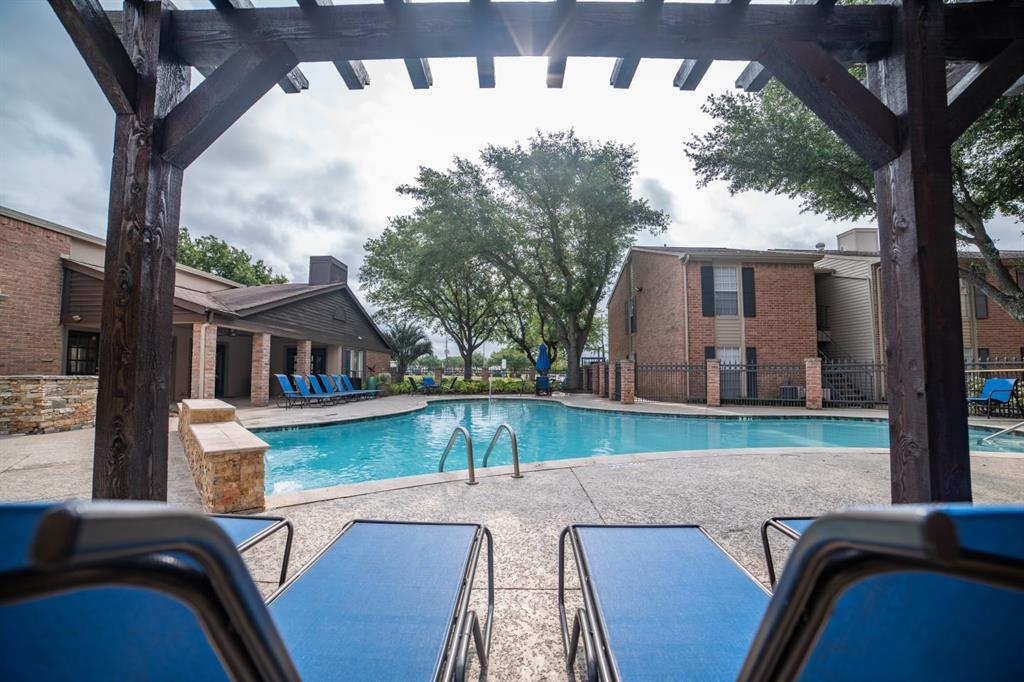 a view of backyard of house with seating space