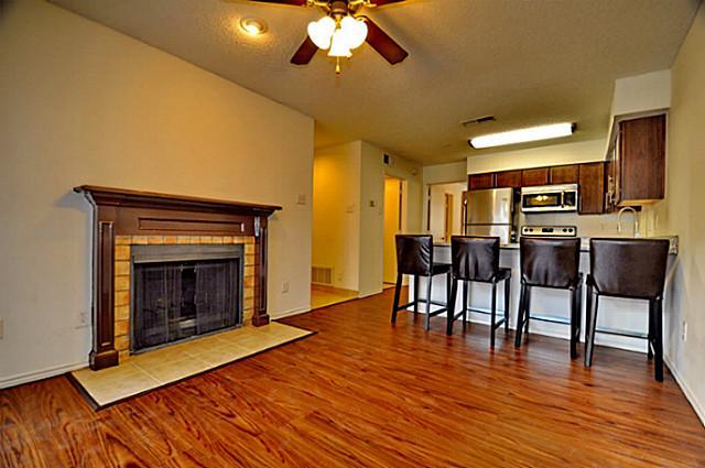 a view of a livingroom with furniture and a fireplace