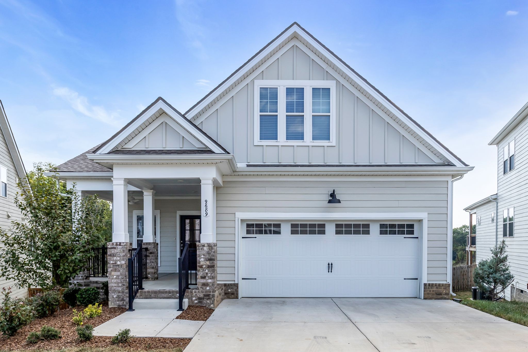 a front view of a house with a garage