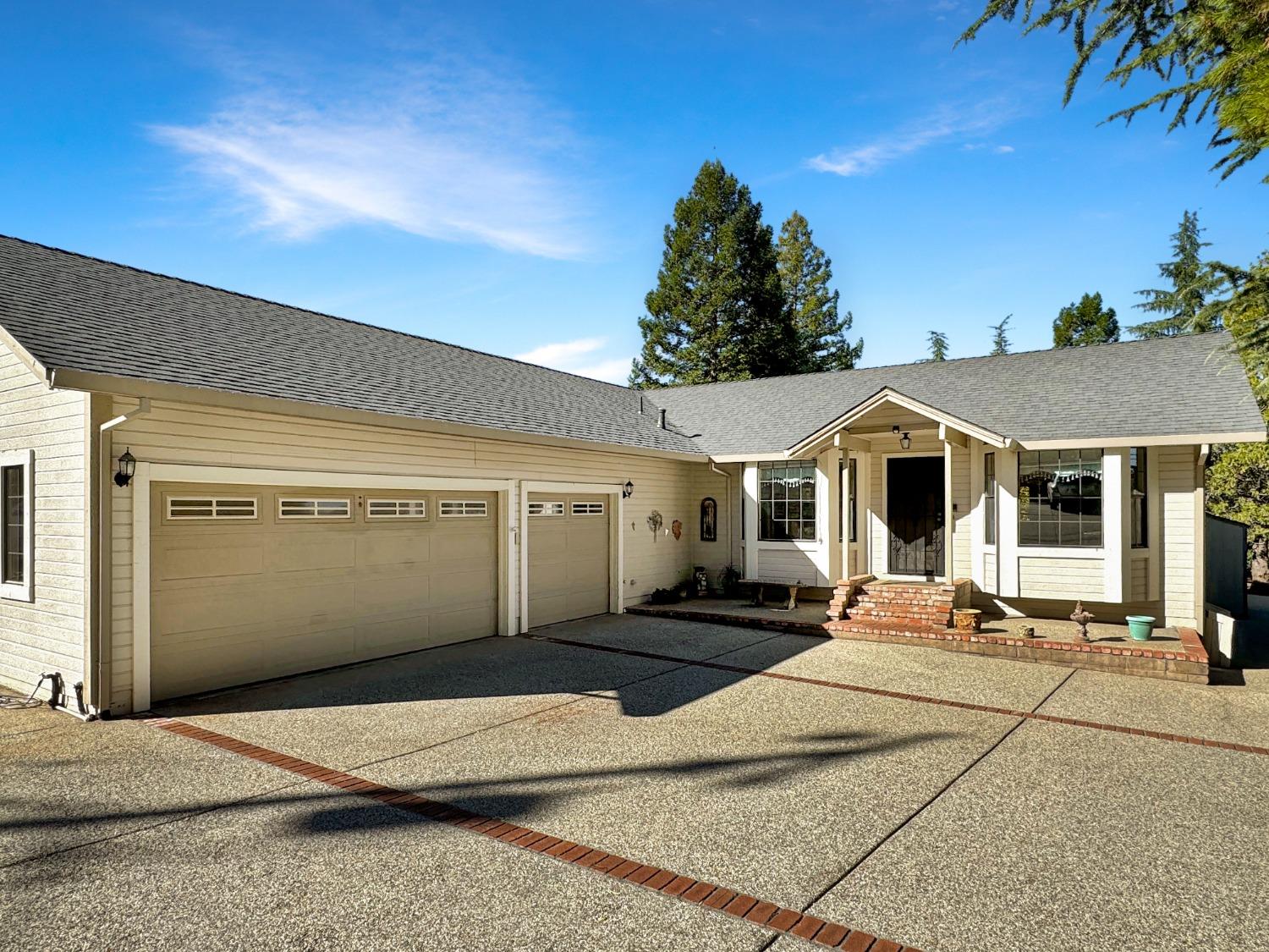 a front view of a house with yard