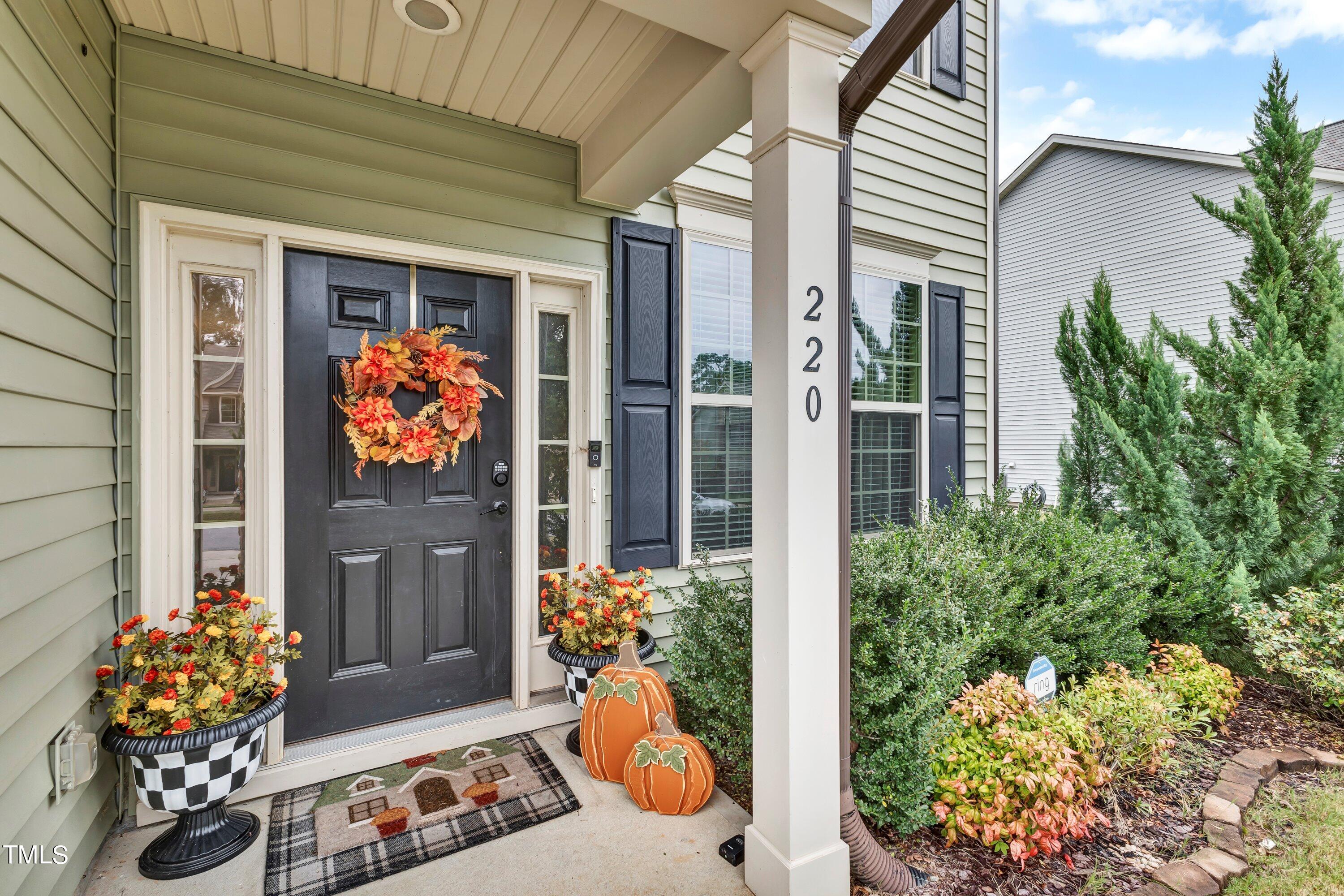 a outdoor view of a house with outdoor seating