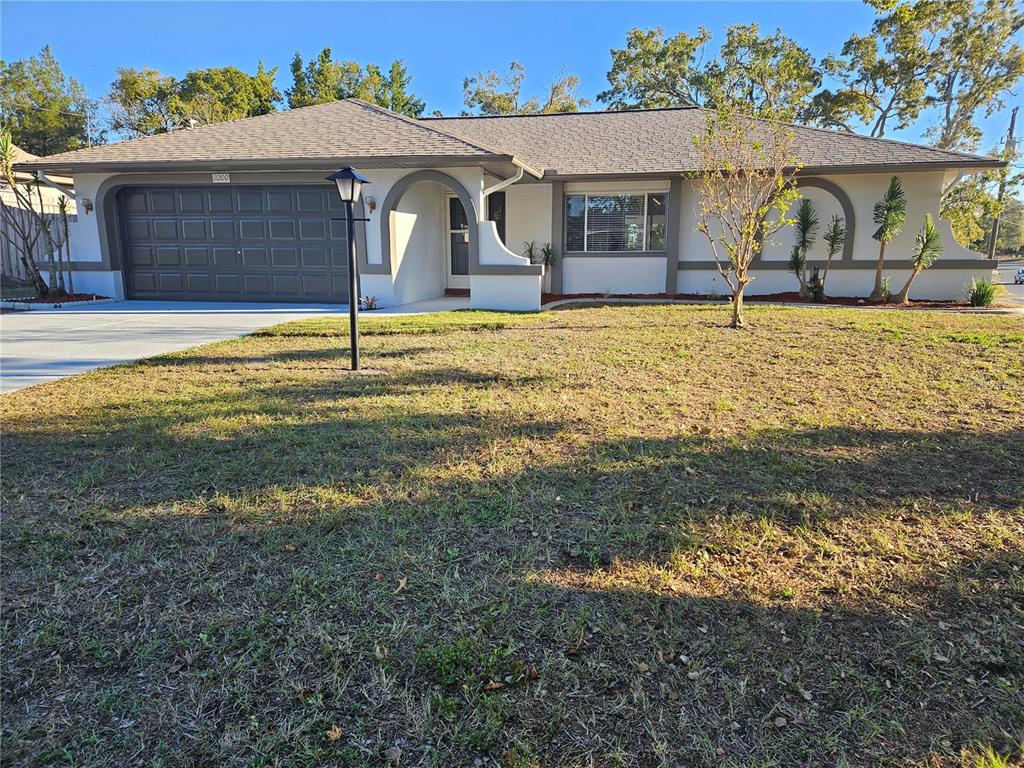 a view of a house with a yard