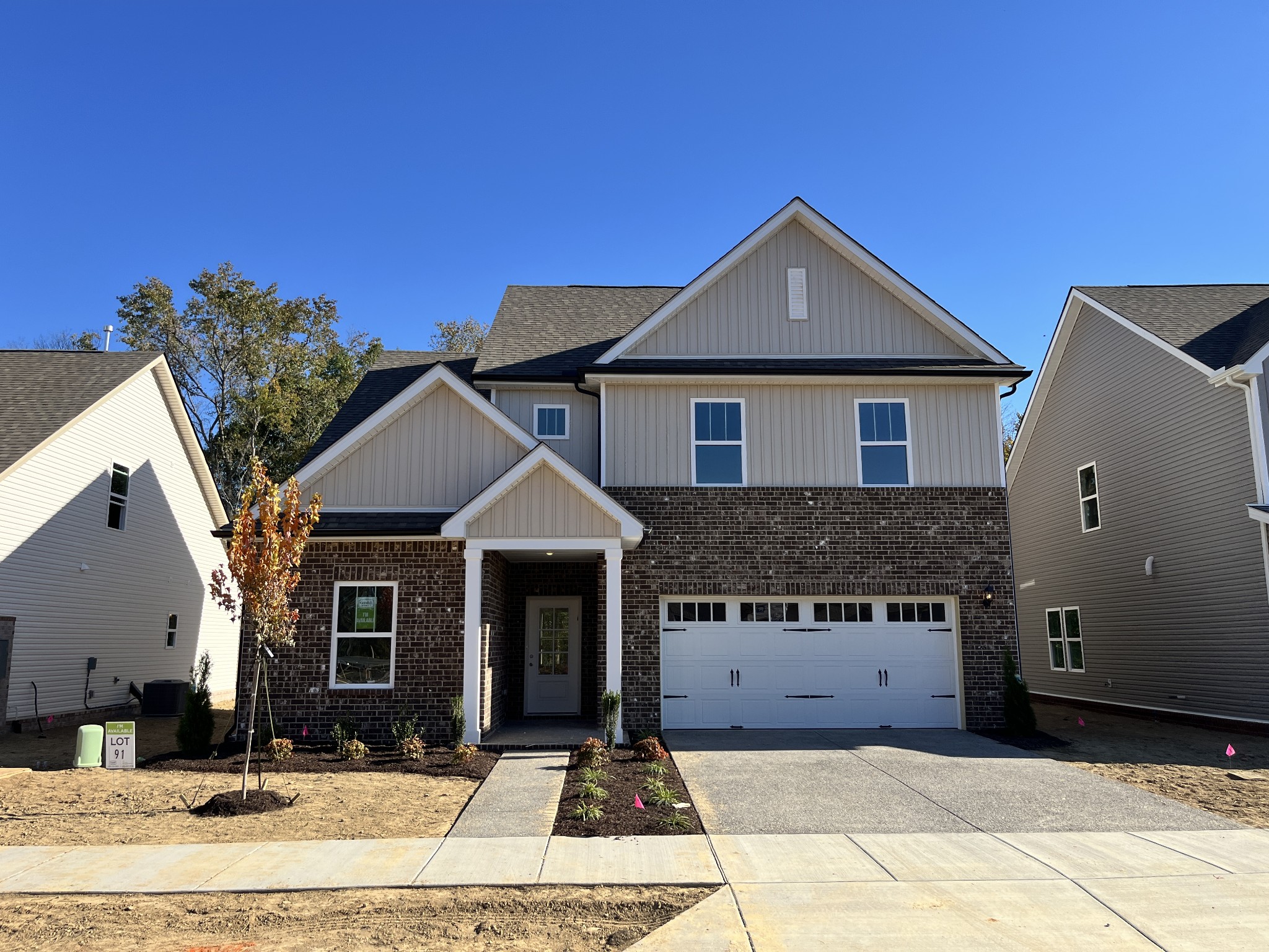 a front view of a house with yard