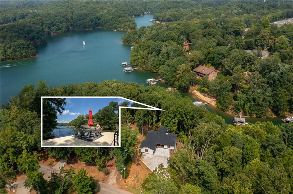 an aerial view of a house with a yard basket ball court and outdoor seating