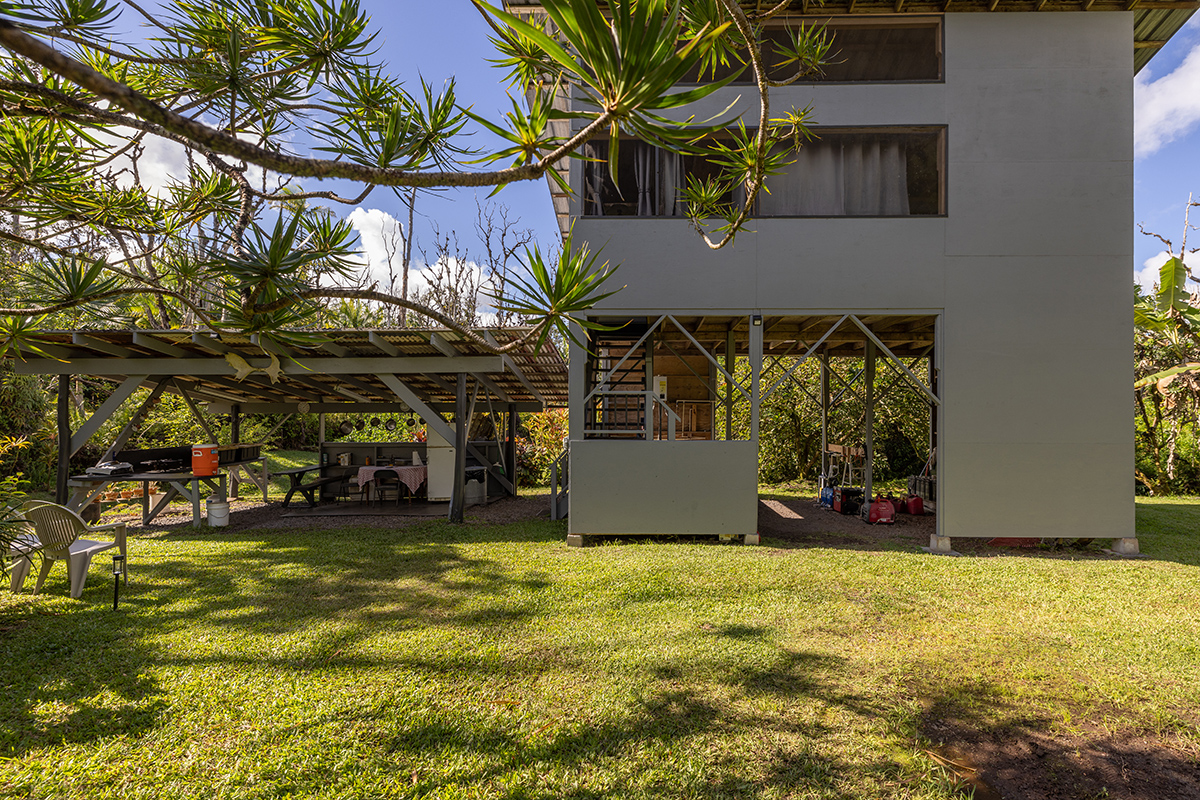 a view of a house with swimming pool and sitting area