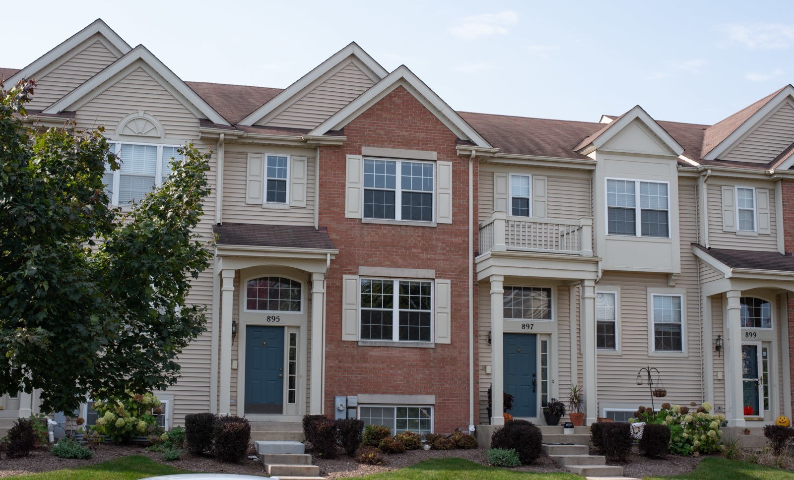 a front view of a house with a yard