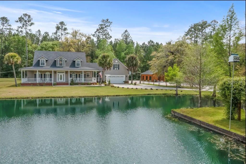 a view of a lake with houses in the back